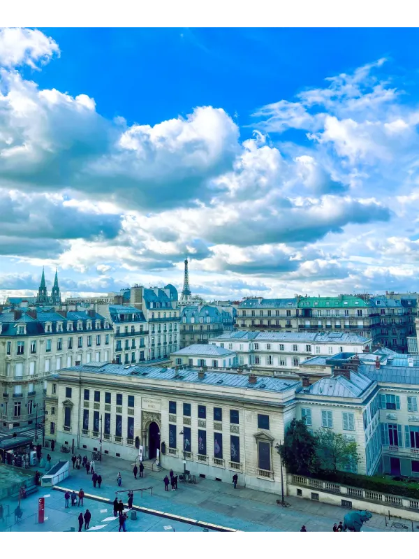 Picture shows Paris Panorama and Eiffel Tower from distance. Find an ultimate travel guide to Paris, France. 