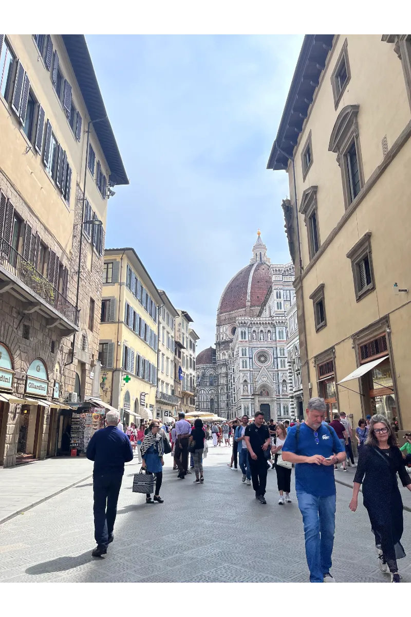 How to travel Europe Cheaply - picture of the people in the street in Florence, Italy.