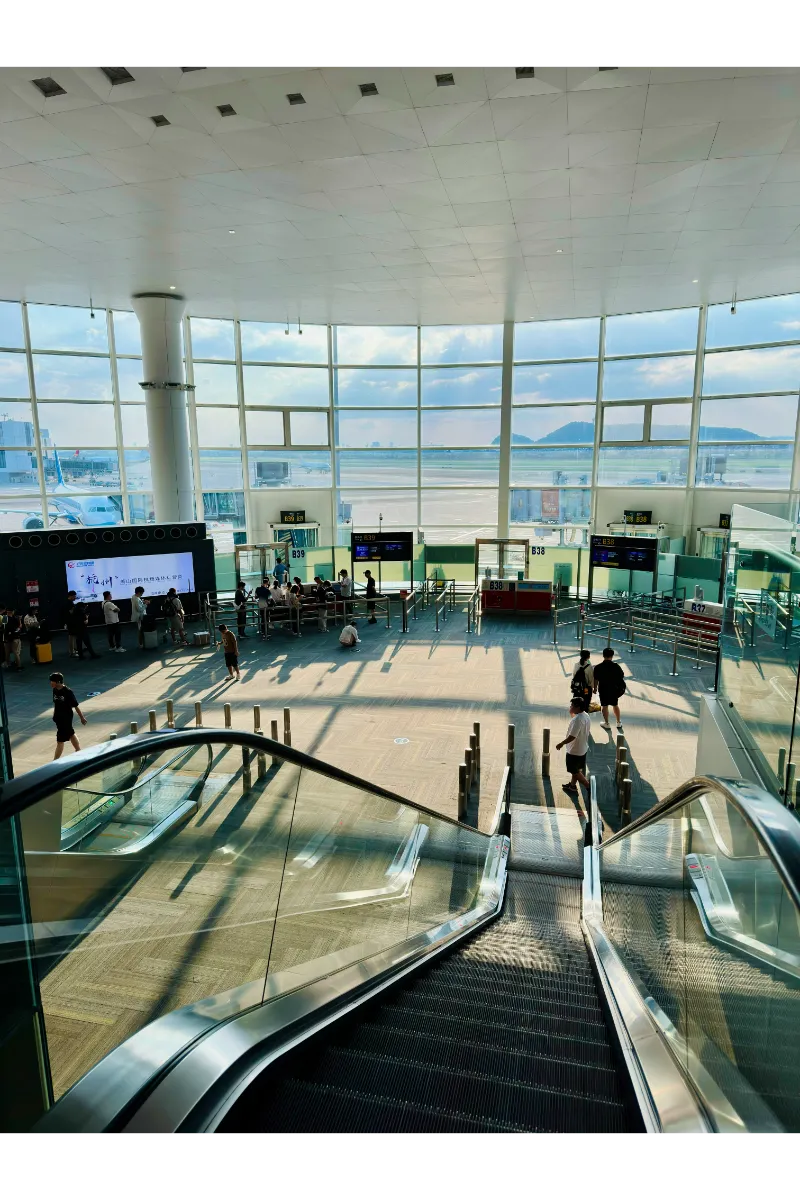 How to Travel Europe Cheaply - picture of stairs at the airport.